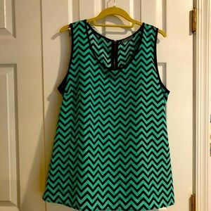 Like new sleeveless tank/shell.  XL size.  Green and navy blue chevron pattern.
